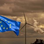 Waving,European,Flag,In,Front,Of,A,Polluting,Factory,Chimney