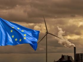 Waving,European,Flag,In,Front,Of,A,Polluting,Factory,Chimney